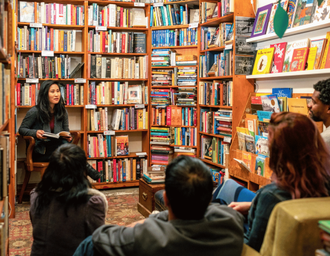 Image of author presenting to an audience.