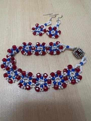 beaded bracelet and earrings in red, white, and blue