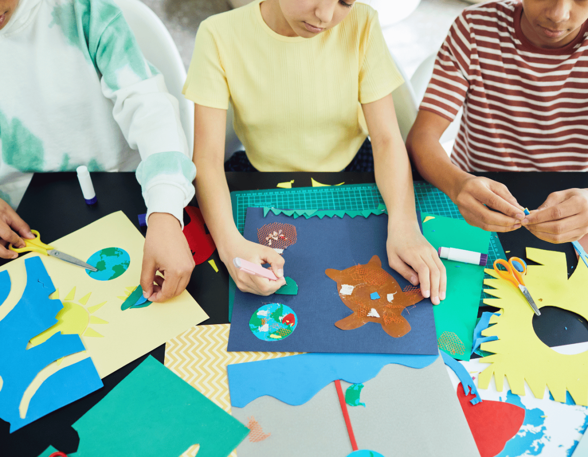 Partial image of younger teens creating paper collages